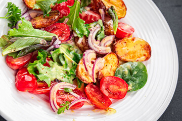 salad baked potato vegetable potato, tomato, onion, green salad leaves, salad dressing vinaigrette vegetables food healthy meal food snack on the table copy space food background rustic top view 