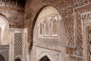 Rich decorated facade in the courtyard of the Medersa Attarine in Fes