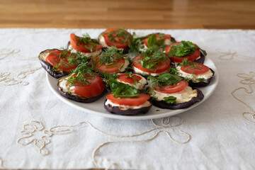 Zuchini, tomatoes, mozzarella, basil in a plate