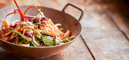 stir fried noodles with thai spicy salad