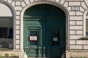 Entrance door to the house with the inscription in German 