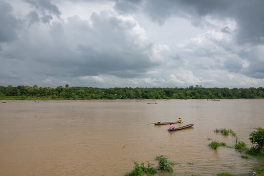 Dark clouds and rainstorm over the river rainy season in thailand