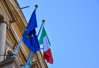 Italian flag. The flag of Italy and the European Union, placed on the building.