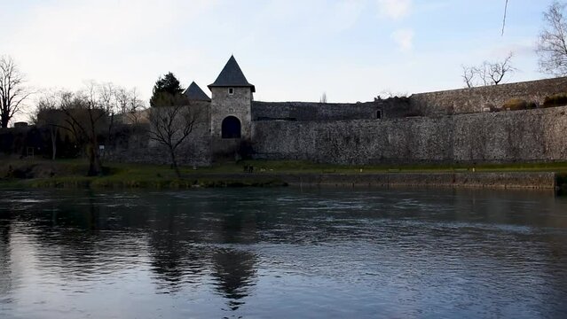 Medieval fortress Kastel on riverbank of Vrbas river at evening