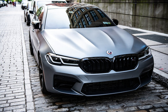 New York City, USA - July 15, 2023: BMW F90 M5 grey color car parked, corner view