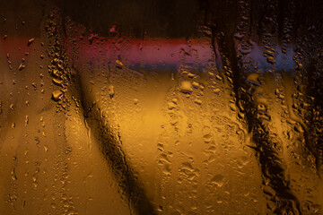 raindrops on the glass in the late evening.
