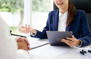 lawyer having meeting and consoling solution to her clients provide legal advice and trust commitment strain serious for problem, justice and attorney concept