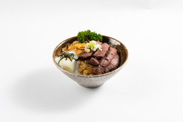 Beef Bowl. bowl of white rice topped with slices of grill beef. Japanese food on restaurant table. Isolate on white background