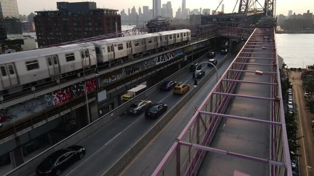 Manhattan bound J train at sunset Williamsburg Bridge