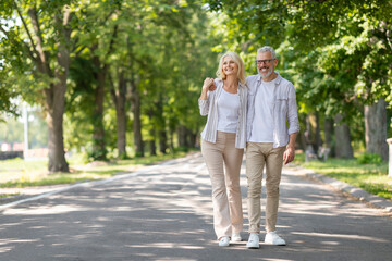Fototapeta na wymiar Portrait of beautiful senior couple walking in park together
