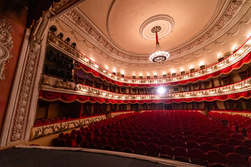 Fototapeta premium Big theatre sitting hall. Cinema modern interior seating place.