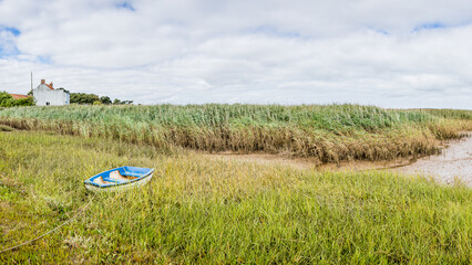 Lone boat at Brancaster Staithe - 637040509
