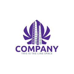 Lotus Property Real Estate Logo with a Pair of Skyscrapers as a Negative Space inside a Flower Shape. 