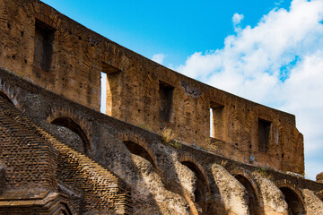 The robust arches of the Roman Colosseum stand tall, punctuating the sky with the enduring strength...