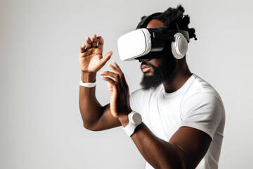 Attractive black american bearded man looking through virtual reality headset, indoor shot over white background. Male wearing VR goggles.