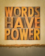 words have power message - abstract in vintage letterpress wood type against art paper, communication concept