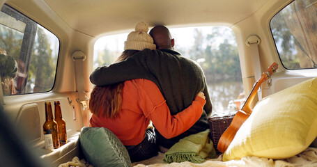 Hug, winter and a couple in a car for a road trip, date or watching the view together. Happy,...