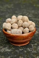 closeup the bunch brown soya bean chunk in the orange wooden bowl soft focus natural brown background.