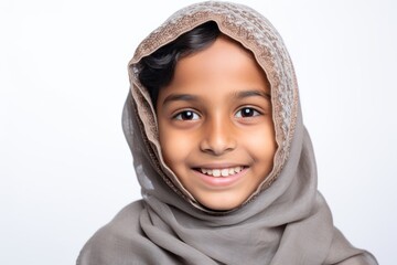 Portrait of a cute muslim little girl wearing hijab over white background