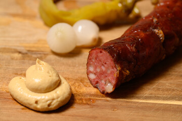 Grilled Kasekrainer or Cheese Kransky Austrian Sausage with Pickled Onions and Hot Pepper