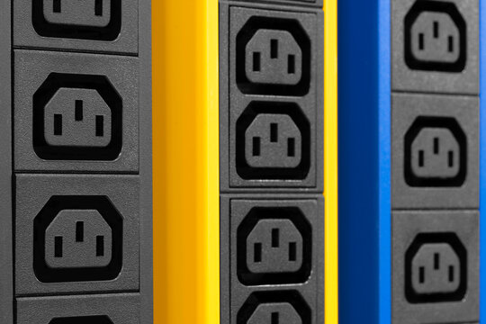 Electricity sockets IEC 60320 C13 in the server rack. Electicity sockets (Iin the server rack as technology style concept background as template, page or web banner