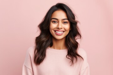 Obraz premium people, beauty and fashion concept - happy young asian woman in pink sweater over pink background