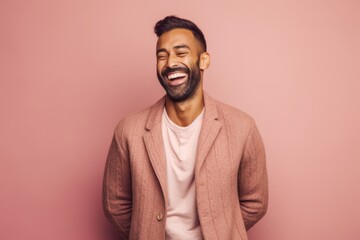 Obraz premium happy african american man in beige jacket on pink background