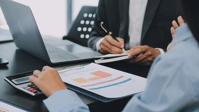 .Financial Business team present. Business man hands hold documents with financial statistic stock photo, discussion, and analysis report data the charts and graphs. Finance Financial concept