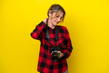 Uruguayan photographer woman isolated on yellow background with neckache