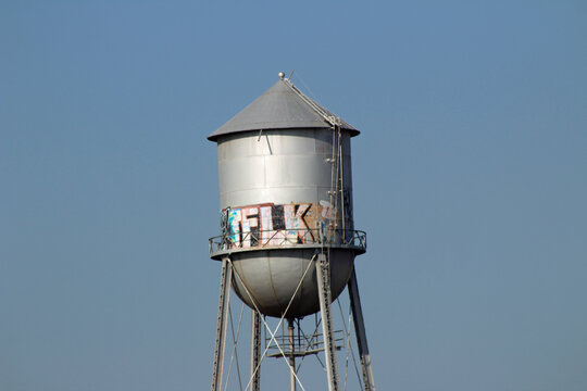 Water Tower With Grafitti