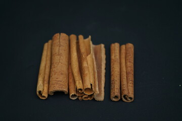 Cinnamon sticks on black background , 