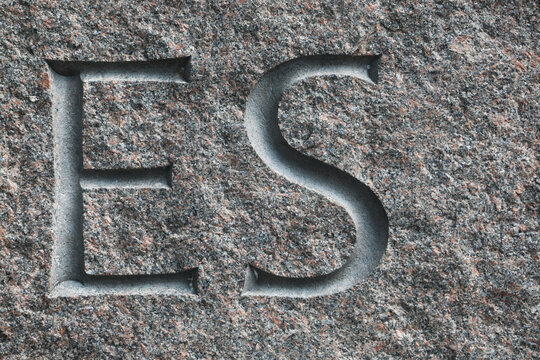 letters on the stone wall