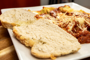 Freshly Baked Fully Homemade Spinach Cannelloni Served With Freshly Baked Asiago Cheese Bread 