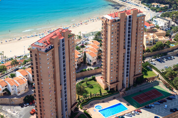 High-rise buildings tower over a sandy beachfront.. Benidorm, Spain