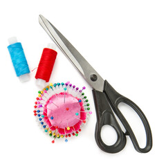 A pair of scissors and Set of sewing accessories isolated on a white . Free space for text. Collage.