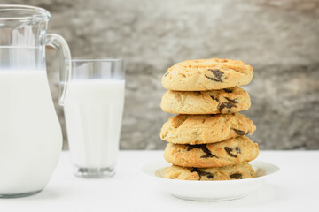 Homemade chocolate chip cookies, Cookies and a jug of milk
