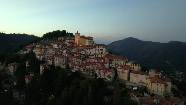 Aerial footage of the Sacro Monte of Varese at sunset, this sacred mount is a historic pilgrimage site and Unesco World Heritage for the Sanctuary of Santa Maria del Monte, Varese, Lombardy, Italy