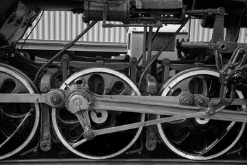 An old steam locomotive of the early 20th century on the railway track.