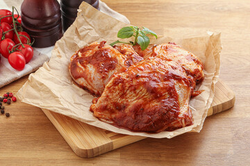 Marinated chicken leg in tomato sauce