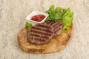 Grilled beef burger cutlet with sauce