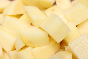 chopped peeled potato. potato with selective focus. peeled and chopped yellow natural food.