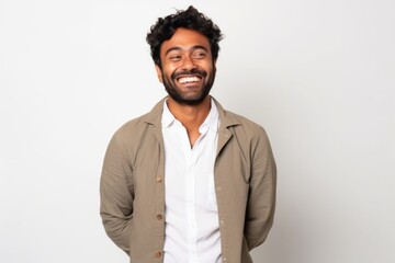 Obraz premium Medium shot portrait of an Indian man in his 20s against a white background