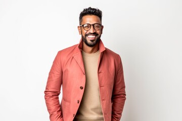 Obraz premium Lifestyle portrait of an Indian man in his 30s against a white background