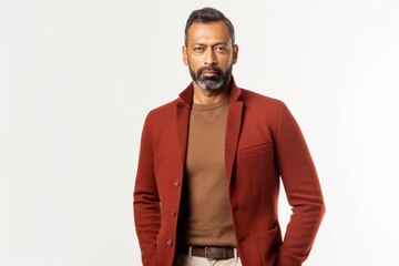 Lifestyle portrait of an Indian man in his 40s against a white background