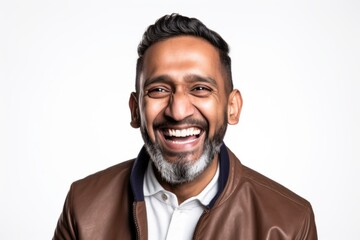 Obraz premium Lifestyle portrait of an Indian man in his 40s wearing hijab against a white background