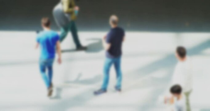 Time lapse.fast shooting.Blurred silhouettes of many business people moving quickly inside a large building.A crowd of unrecognizable people hurrying about their business.Blurry defocused video
