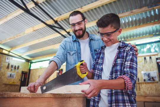 Father and son working with wood