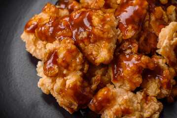 Delicious juicy grilled chicken meat bites with salt, spices and herbs
