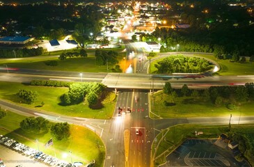 Bustling city street at night, illuminated by the glow of street lights in Graham, North Carolina