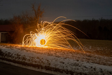 Long exposure of steel wool sparks in a field